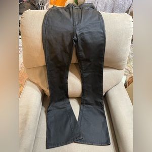 Black stretchy boot cut pants made of 45% polyester 10% spandex